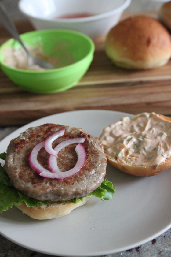 turkey burgers with spicy herb mayo and pickled onions